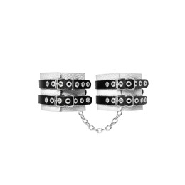 Бело-черные оковы с двумя ремешками и люверсами