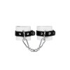 Бело-черные кожаные наручники с одним ремешком с люверсами