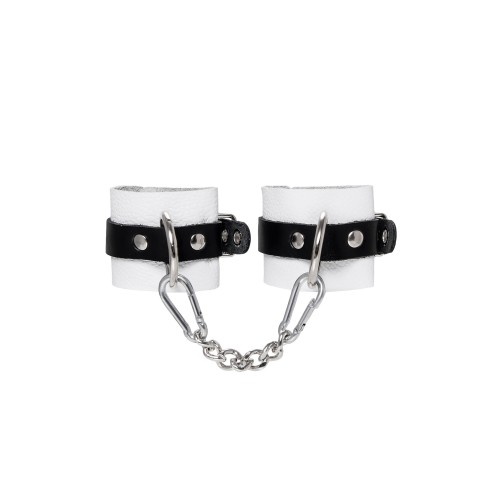 Бело-черные кожаные наручники с одним ремешком с люверсами