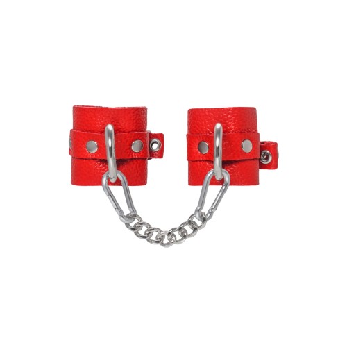 Красные мягкие кожаные наручники с люверсами