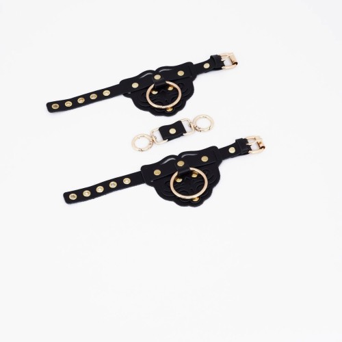 Черные наручники с золотистой фурнитурой