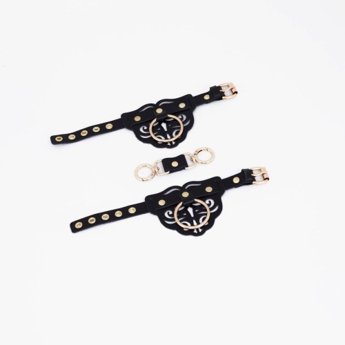 Черные наручники с золотистой фурнитурой