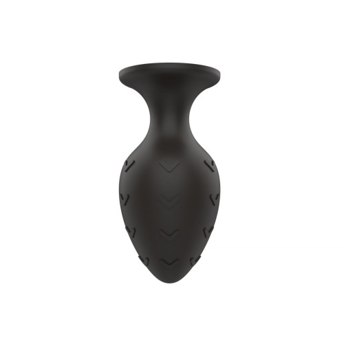 Черная средняя силиконовая анальная пробка с рельефом в виде галочек